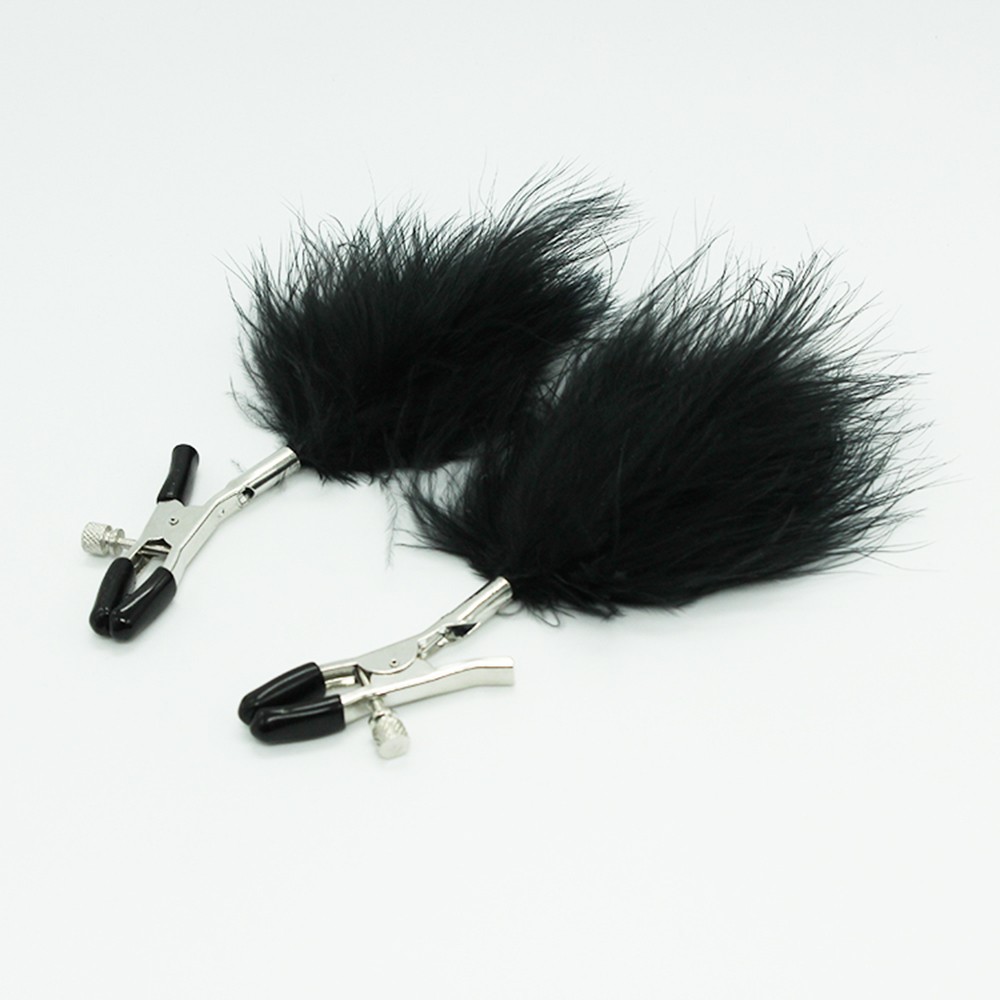 Pinces à seins avec plumes noires Couleur : Noir 1 Pinces à seins avec plumes noires Couleur : Noir